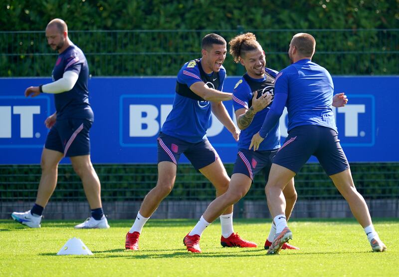 England players Conor Coady, Kalvin Phillips and Luke Shaw during a training session at Hotspur Way. PA
