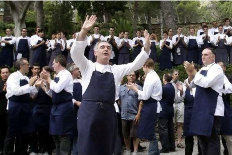 Ferran Adria, the chef of El Bulli restaurant, celebrates with his team in Cala Montjoi, near Roses in Catalonia, on Saturday. The world-renowned and award-winning restaurant will be closed down until 2014 when it will open as a culinary research centre, the El Bulli Foundation.
