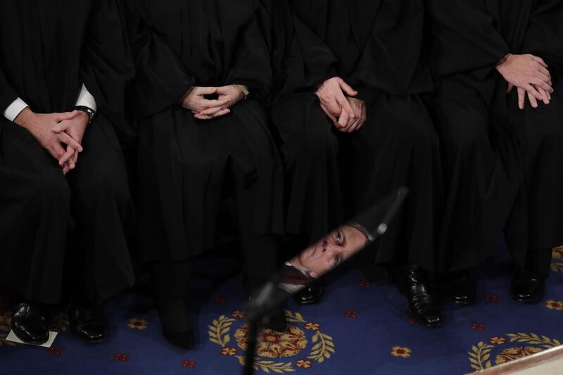 US Supreme Court Justice John Roberts is reflected in a teleprompter as other Supreme Court Justices (T) listen to US President Donald Trump deliver his State of the Union address during a joint session of congress in the House chamber of the US Capitol in Washington, DC.  EPA