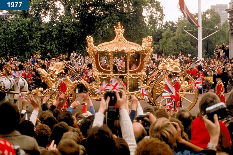 1977: The crowd cheers the queen in her gilded state coach during her silver jubilee procession.
