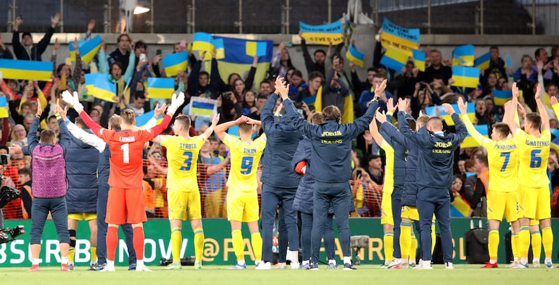Ukraine players celebrate with fans after the Nations League match at Aviva Stadium. AFP