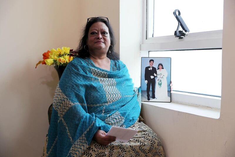 SHARJAH , UNITED ARAB EMIRATES ,  November 6 , 2018 :- Pricilla Helen Aden with the photo of her Late husband at her home in Sharjah. She got her new six-month residency visa during the amnesty period.  ( Pawan Singh / The National )  For News. Story by Ramola