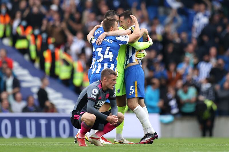 BRIGHTON, ENGLAND - SEPTEMBER 19: Players of Brighton & Hove Albion celebrate their victory as Jamie Vardy of Leicester City reacts following the Premier League match between Brighton & Hove Albion and Leicester City at American Express Community Stadium on September 19, 2021 in Brighton, England. (Photo by Eddie Keogh / Getty Images)