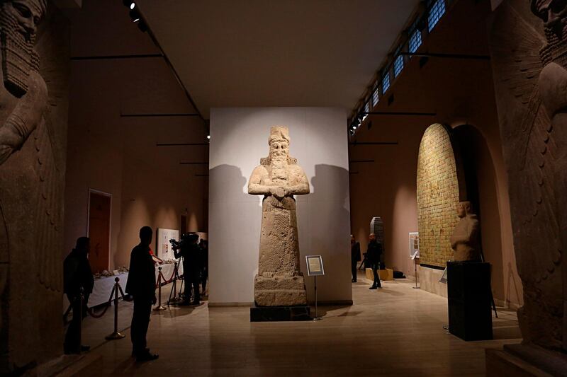 People visit the Assyrian Hall at the Iraq National Museum in Baghdad. AP