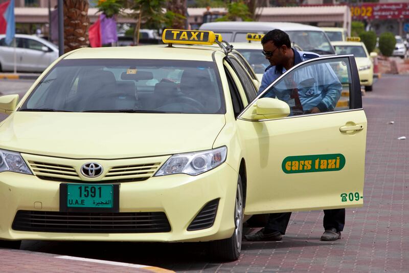 FUJEIRAH, UNITED ARAB EMIRATES,  AUGUST 13, 2013. The start to the Sheikh Khalifa highway heading from the Kalba Highway towards Fujairah. Taxi drivers in Fujeirah use the new highway to ferry their passengers faster to Dubai and Sharjah. (ANTONIE ROBERTSON / The National) Journalist Hareth Albustani *** Local Caption ***  AR_1308_Sheikh_Khalifa_Highway-07.jpg