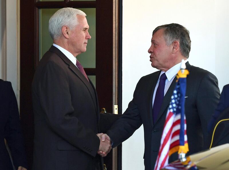 Vice President Mike Pence, left, shakes hands with King Abdullah II of Jordan as they walk out of the White House in Washington, Monday, Nov. 27, 2017, following their meeting. (AP Photo/Susan Walsh)