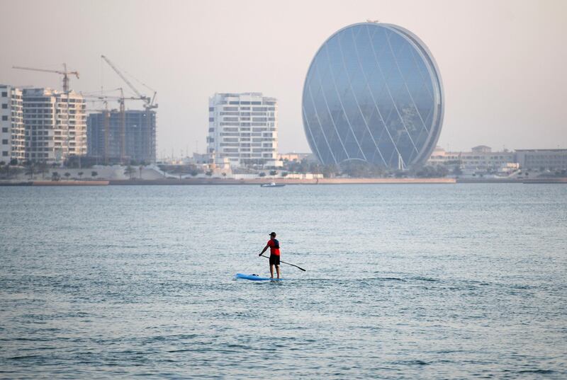 Evening-AD A man paddle boarding on Yas Beach, in Abu Dhabi on June 3, 2021. Khushnum Bhandari / The National 
Reporter: N/A News
