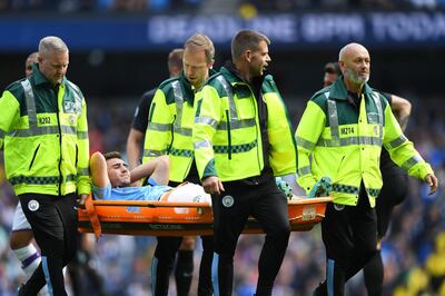 MANCHESTER, ENGLAND - AUGUST 31: Aymeric Laporte of Manchester City is stretchered off the pitch during the Premier League match between Manchester City and Brighton & Hove Albion at Etihad Stadium on August 31, 2019 in Manchester, United Kingdom. (Photo by Shaun Botterill/Getty Images)