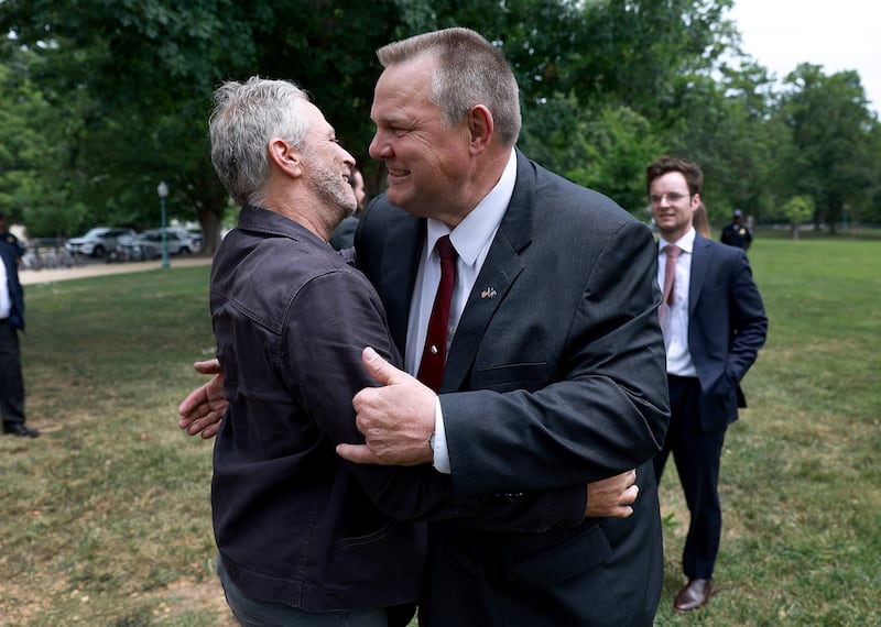 Senator John Tester and Stewart embrace. Getty Images / AFP
