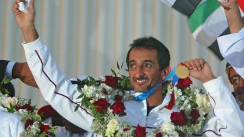 Sheikh Ahmed bin Hasher displays his medal after winning the UAE's first ever gold in 2004.
