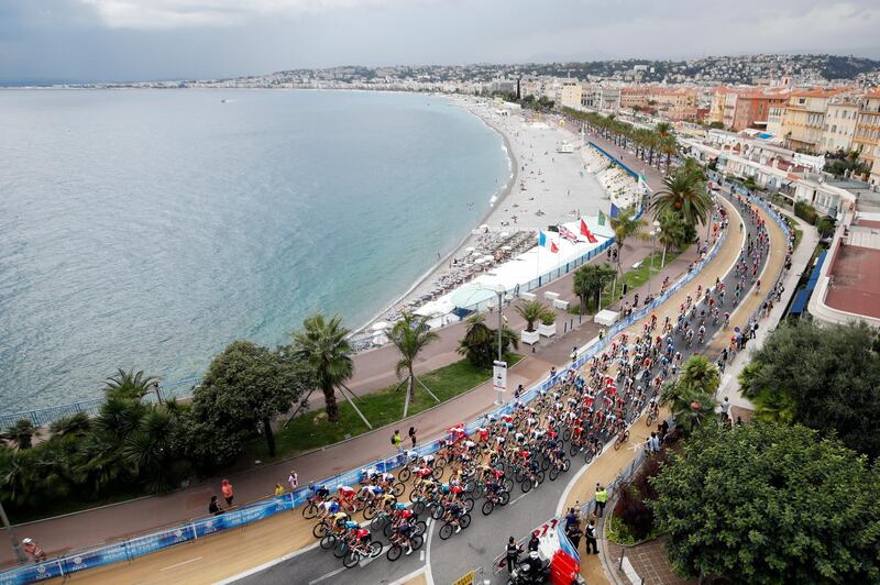 The peloton rides along the beach on the Promenade des Anglais in Nice during Stage 1 the Tour de France on Saturday, August 29. EPA