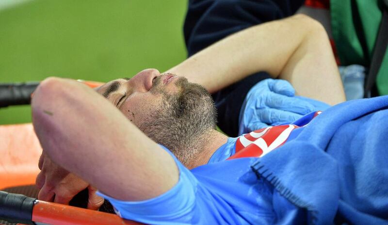 Napoli may be without Argentinian forward Gonzalo Higuain, here bing stretchered off the pitch after being injured during the Italian Serie A match against Inter Milan at Giusepe Meazza stadium in Milan, Italy, on April 26m 2014.  Even if he is available he may not be at full-match fitness. Daniel Dal Zennaro / EPA