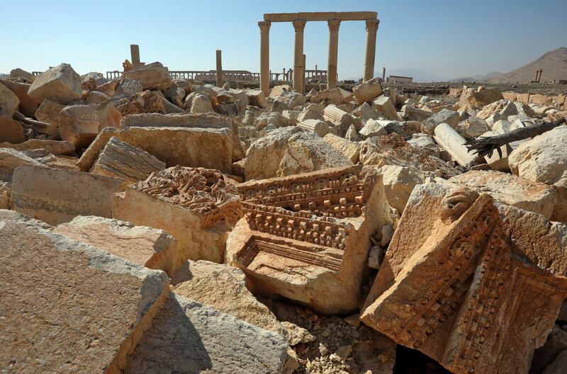 A picture shows the ruins of Syria's Roman-era ancient city of Palmyra on February 7, 2021, in the country's central province of Homs. - Syria has six sites listed on the UNESCO elite list of world heritage and all of them sustained some level of damage in the 10-year war. Besides Palmyra and Aleppo, the ancient cities of Damascus and Bosra also sustained some damage. (Photo by LOUAI BESHARA / AFP)