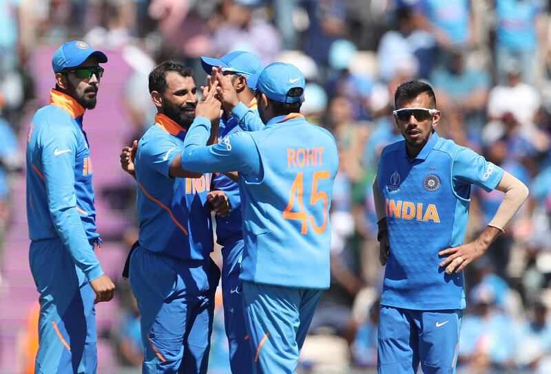 India's Mohammed Shami, second left, celebrates with teammates the dismissal of Afghanistan's Hazratullah Zazai during the Cricket World Cup match between India and Afghanistan at the Hampshire Bowl in Southampton, England, Saturday, June 22, 2019. (AP Photo/Aijaz Rahi)