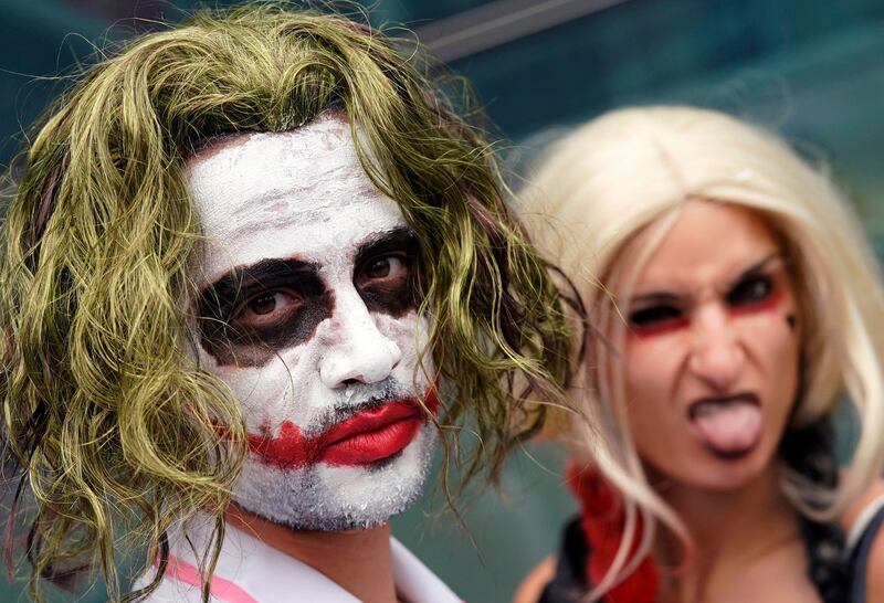 Attendees cosplay as the Joker and Harley Quinn at New York Comic Con. Timothy A Clary / AFP