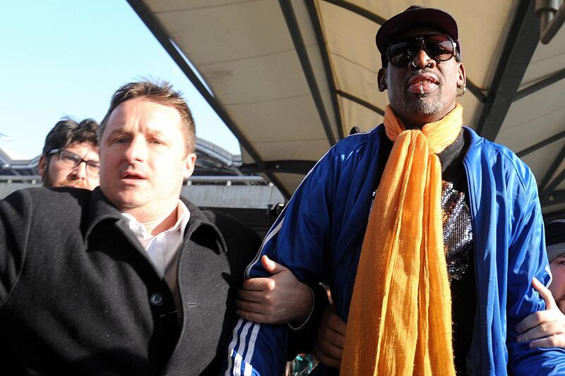 (FILES) In this file photo taken on January 13, 2014 Michael Spavor (L) and former US basketball player Dennis Rodman (R) arrive at Beijing International Airport from North Korea. Ottawa on December 13, 2018 identified the second Canadian questioned in China as Michael Spavor, and said he has been missing since he last made contact with Canadian officials. / AFP / WANG Zhao
