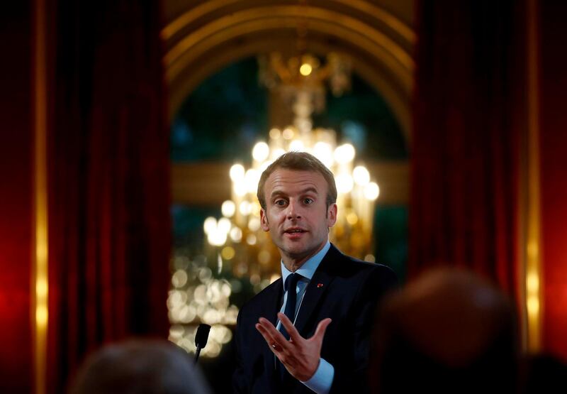 French President Emmanuel Macron attends a reception on local food trade at the Elysee Palace in Paris, on April 27, 2018.  / AFP PHOTO / POOL / CHRISTIAN HARTMANN