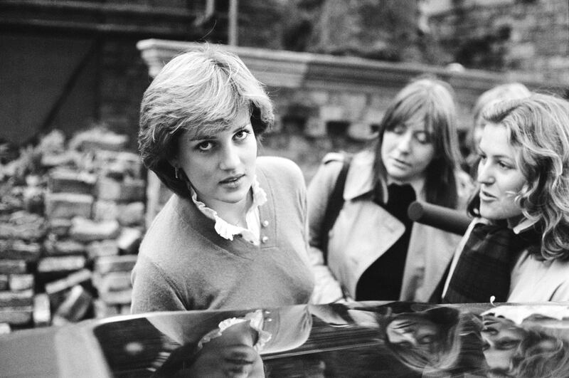A 19-year-old Lady Diana Spencer speaks to the press while getting into a car in London, in 1980.