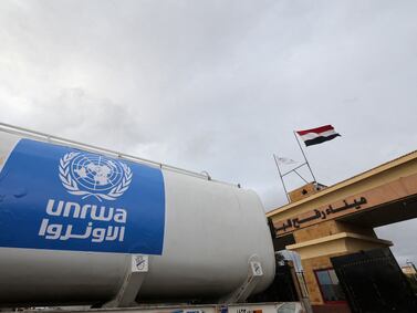 A lorry, marked with United Nations Relief and Works Agency (UNRWA) logo, crosses into Egypt from Gaza, at the Rafah border crossing between Egypt and the Gaza Strip, during a temporary truce between Hamas and Israel, in Rafah, Egypt, November 27, 2023.  REUTERS / Amr Abdallah Dalsh / File Photo