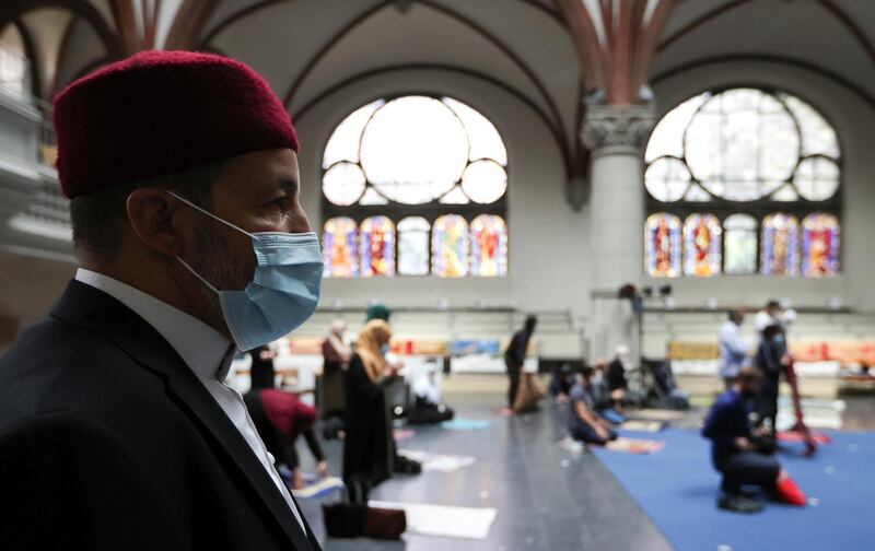 Muslims pray inside the evangelical church of St. Martha's parish, during their Friday prayers, as the community mosque can't fit everybody in due to social distancing rules, amid the coronavirus disease (COVID-19) outbreak in Berlin, Germany, May 22, 2020.   REUTERS/Fabrizio Bensch