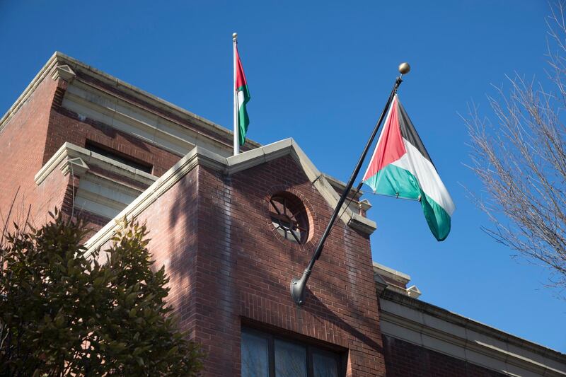 epa06348429 Palestinian flags fly at the office of the Palestine Liberation Organization (PLO) in Washington, DC, USA, 24 November 2017. The PLO has threatened to cut off ties with the US following the announcement of the Trump administration's intention to close the office in Washington.  EPA/MICHAEL REYNOLDS