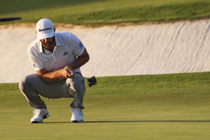 AUGUSTA, GEORGIA - NOVEMBER 14: Dustin Johnson of the United States reacts after missing a birdie putt on the 17th green during the third round of the Masters at Augusta National Golf Club on November 14, 2020 in Augusta, Georgia.   Rob Carr/Getty Images/AFP
== FOR NEWSPAPERS, INTERNET, TELCOS & TELEVISION USE ONLY ==
