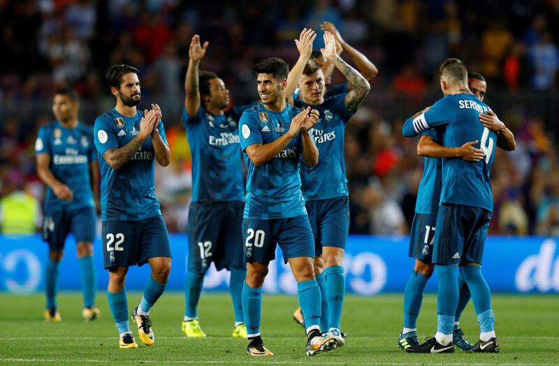 Soccer Football - Barcelona v Real Madrid Spanish Super Cup First Leg - Barcelona, Spain - August 13, 2017   Real Madrid’s Marco Asensio celebrates with teammates after the match    REUTERS/Juan Medina