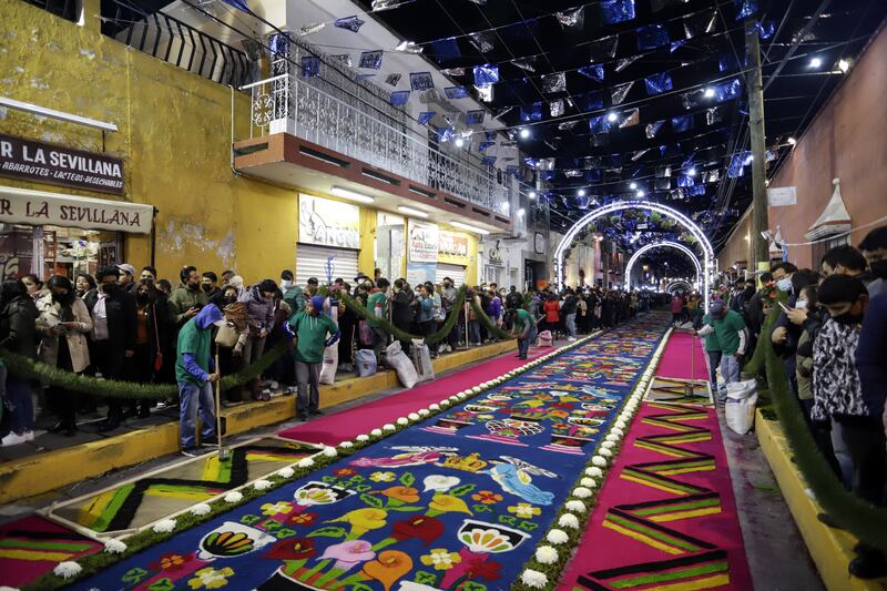 This 3,932-metre sawdust rug broke the Guinness world record for length and was made by 240 artisans using 80 tonnes of multi-coloured sawdust. EPA 