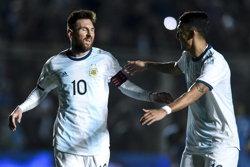 Argentina's Lionel Messi, left, in action against Nicaragua in San Juan, Argentina, on Friday. Marcelo Endelli / Getty Images