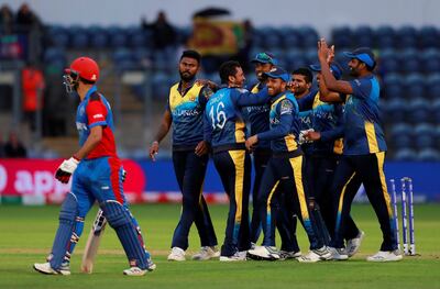 Cricket - ICC Cricket World Cup - Afghanistan v Sri Lanka - Cardiff Wales Stadium, Cardiff, Britain - June 4, 2019   Sri Lanka players celebrate after Afghanistan's Najibullah Zadran is run out   Action Images via Reuters/Andrew Couldridge
