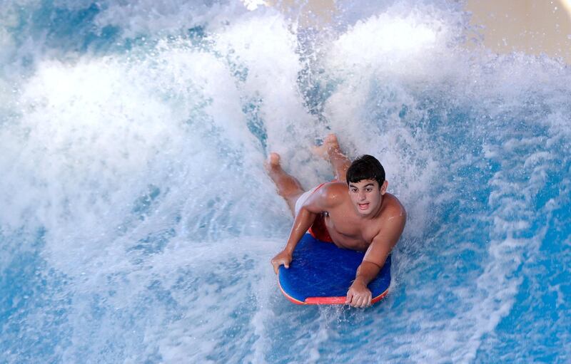 Abu Dhabi, United Arab Emirates, August 4, 2020.   Yas Waterworld Abu Dhabi opens with 30% capacity as Covid-19 restrictions slowly come to an ease.  A body boarder rips the waves at the waterpark.
Victor Besa /The National
Section: NA
Reporter: