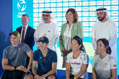 From left, Stuart Leatherby, HE Excellency Aref Awani, Marisol Casado, Khaled Al Fahim, Hana Al Nabulsi, Sharon Bayon, Hayden Wilde, and Jetze Plat ahead of the upcoming Abu Dhabi World Triathlon Finals at Abu Dhabi Sports Council. Khushnum Bhandari / The National