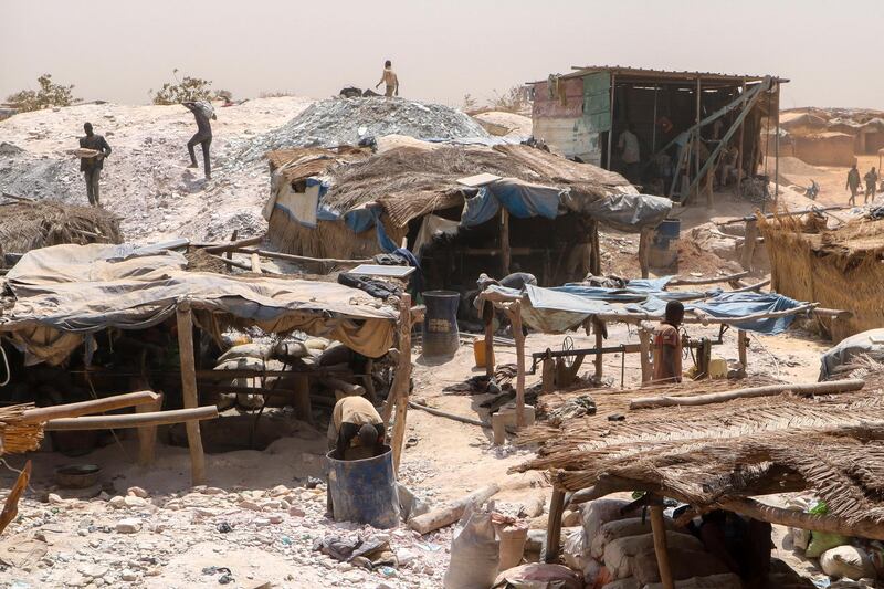 Small-scale gold miners at work in Bouda, Burkina Faso on February 23, 2020. A growing number of miners are out of work as militants try to seize control of the country's most lucrative industry. AP Photo