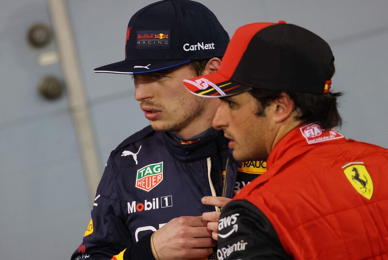 Red Bull's Dutch driver Max Verstappen  talks with Ferrari's Carlos Sainz. AFP