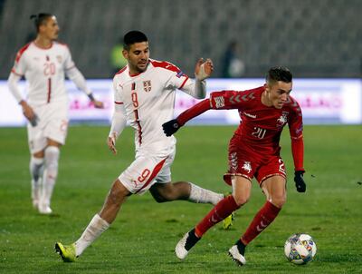 Lithuania's Gratas Sirgedas, right, duels for the ball with Serbia's Aleksandar Mitrovic during the UEFA Nations League soccer match between Serbia and Lithuania at Partizan stadium in Belgrade, Serbia, Tuesday Nov. 20, 2018. (AP Photo/Darko Vojinovic)