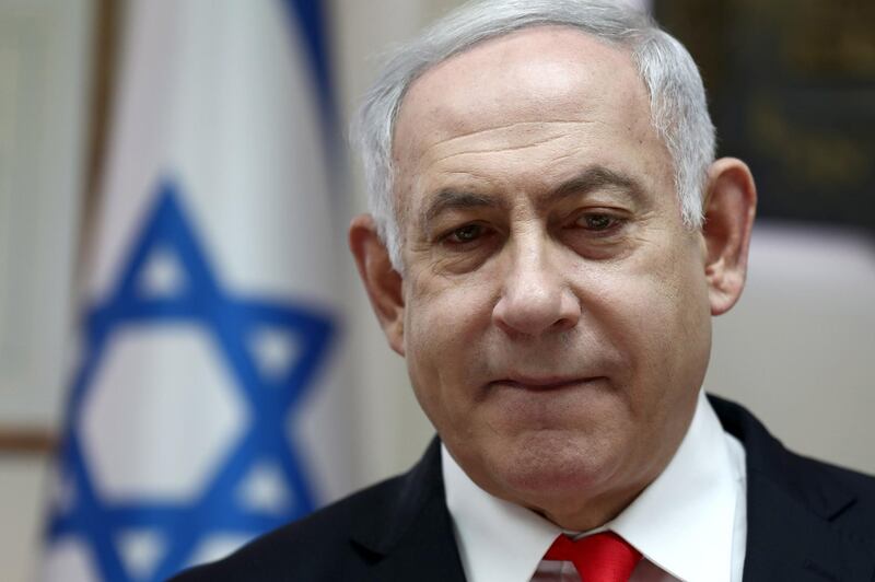 (FILES) In this file photo taken on December 15, 2019 Israeli Prime Minister Benjamin Netanyahu chairs the weekly cabinet meeting at his Jerusalem office.  Embattled Israeli Prime Minister Benjamin Netanyahu declared victory in a leadership primary in his right-wing Likud party on December 26, ensuring he will lead it into March elections. Initial results showed Netanyahu comfortably beating rival Gideon Saar, though a final tally was expected to take several hours. / AFP / POOL / GALI TIBBON
