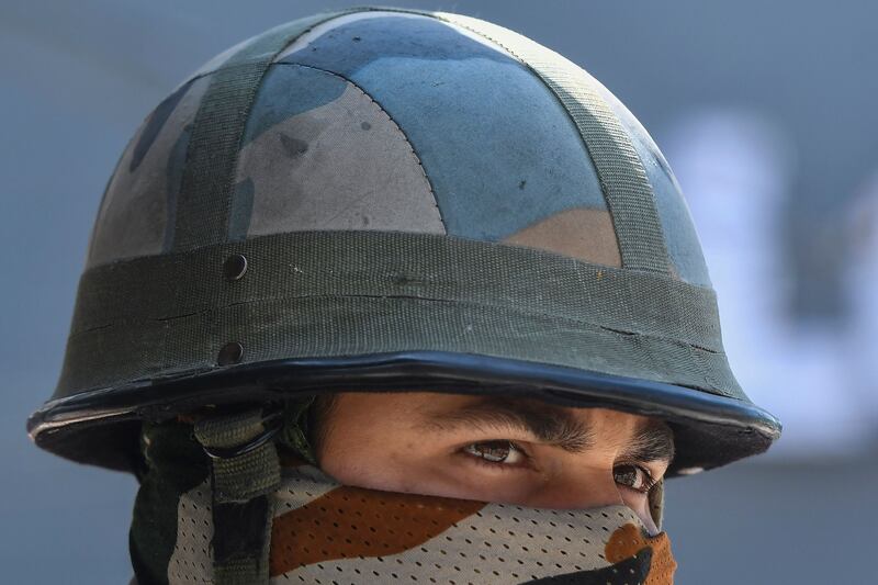 An Indian paramilitary trooper in Srinagar, the capital of Kashmir. The region is ruled by India and Pakistan in part, but claimed by both in its entirety.  AFP
