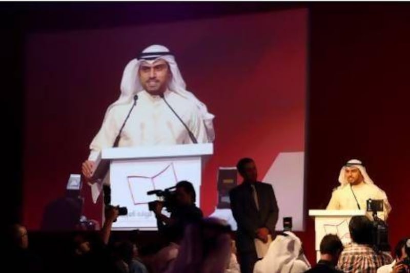 Saud Alsanousi speaks after winning the International Prize for Arabic Fiction in Abu Dhabi on Tuesday. Pawan Singh / The National
