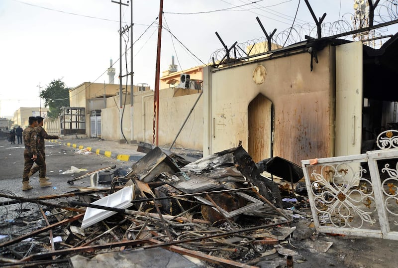 The burnt Iranian consulate is pictured in the southern Iraqi holy city of Najaf on November 28, 2019, two months into the country's most serious social crisis in decades. At least eight Iraqi protesters were shot dead yesterday in clashes with security forces in the southern city of Nasiriyah, medical and security sources said, as authorities cracked down on anti-government demonstrators after an attack on Iran's consulate in Najaf. Around 50 others more wounded, several in critical condition, when security forces tried to retake two bridges in Nasiriyah that had been blocked by the protesters, the sources said, after reporting an earlier toll of two dead.
 / AFP / Haidar HAMDANI
