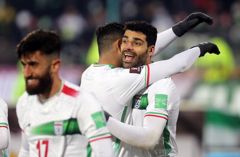 Iran's Mahdi Taremi, right, celebrates after scoring against Iraq at the Azadi Stadium in Tehran. EPA