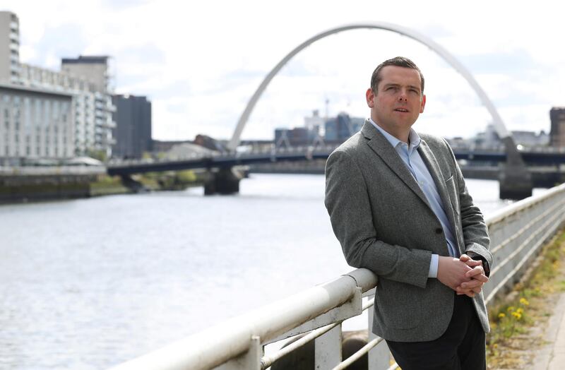 Douglas Ross, leader of the Scottish Conservatives, poses for a portrait, while campaigning in Glasgow. Reuters
