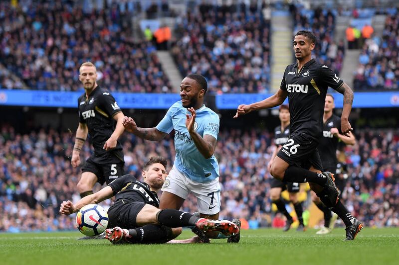 MANCHESTER, ENGLAND - APRIL 22:  Federico Fernandez of Swansea City tackles Raheem Sterling of Manchester City leading to a penalty during the Premier League match between Manchester City and Swansea City at Etihad Stadium on April 22, 2018 in Manchester, England.  (Photo by Laurence Griffiths/Getty Images)