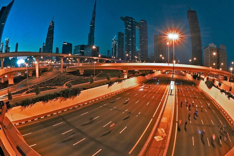 Cyclists passed Dubai landmarks such as Burj Khalifa. Karim Sahib / AFP