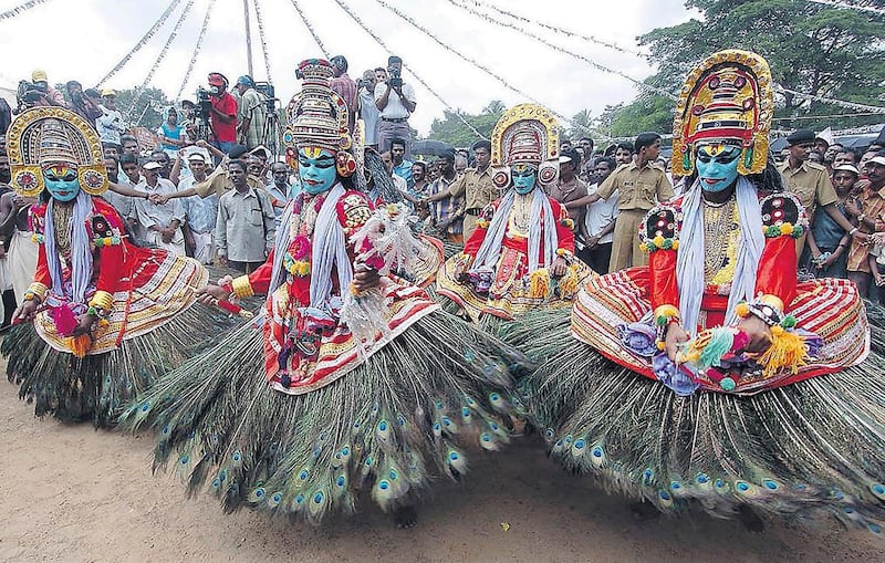 Artists perform a traditional dance during the start of the Onam festival in Cochin, Kerala. AP