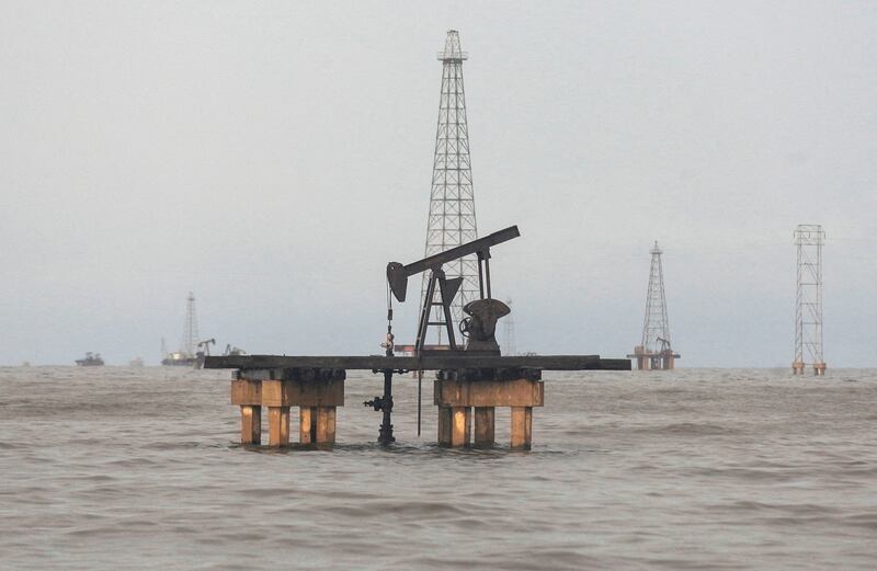 An oil rig on Lake Maracaibo, in Venezuela. Global crude demand is expected to hit record levels this year. Reuters