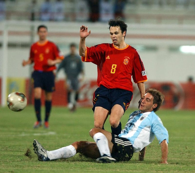 Spaniard Andres Iniesta, then 19, is tackled by Argentina's Pablo Zabaleta during the 2003 Fifa World Youth Championships in a group match in Sharjah. Mohammed Mahjoub / AFP / November 28, 2003