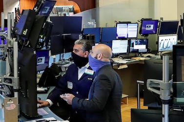 Traders wearing masks work on the floor at the New York Stock Exchange. The big tech stocks – Amazon, Apple, Google-owner Alphabet, Microsoft, Facebook and Netflix - benefited from the pandemic but they may have overreached themselves, say analysts. Reuters