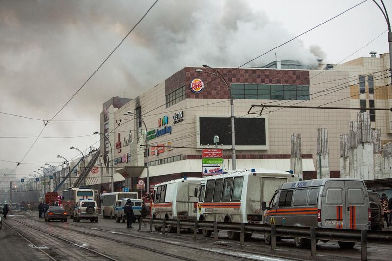 Smoke rises above a multi-story shopping centre in the Siberian city of Kemerovo. Sergei Gavrilenko / AP Photo