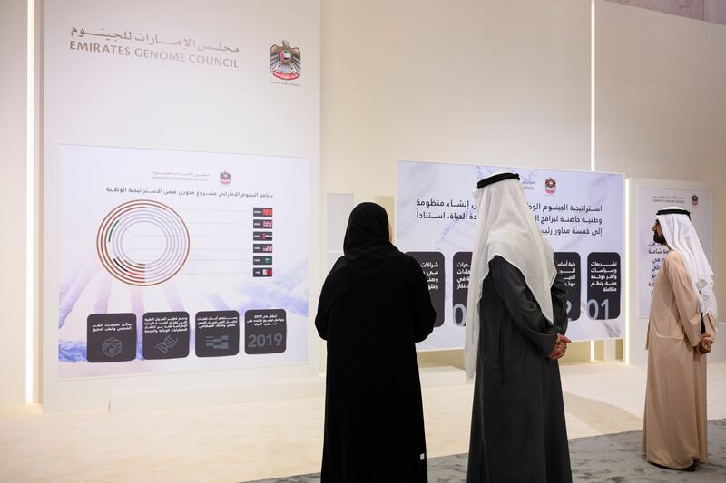 Sheikh Mohamed, Sheikh Mohammed and Ms Al Amiri look at a presentation