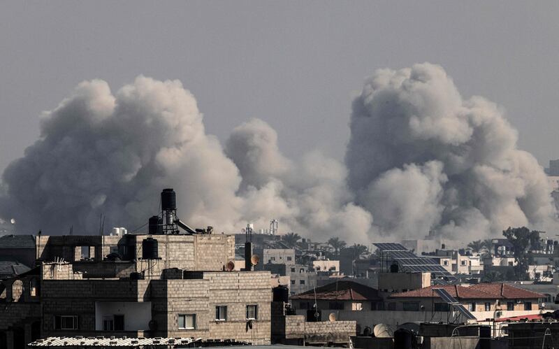 Smoke billows over Khan Yunis in the southern Gaza strip during Israeli bombardment on December 17, 2023. AFP